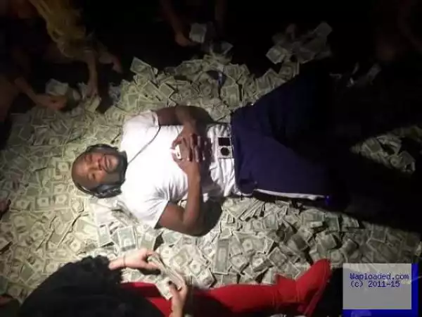 Floyd Mayweather Lies On a Bed Of Money In New Photo